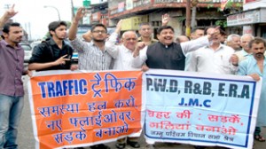 JWAM activists led by its president, Sunil Dimple raising slogans during a protest at Jammu on Friday.
