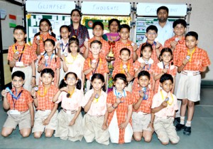 Students of Rich Harvest School Bari Brahmana posing for a group photograph after clinching medals.  