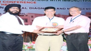 GMC Biochemistry HoD Dr AS Bhatia being honoured at the conference.