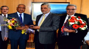 Chairman & CEO JK Bank Mushtaq Ahmad presenting bouquet to outgoing officer at Srinagar on Tuesday.