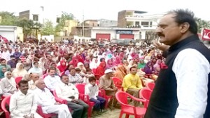 NC leader SS Slathia addressing a public meeting at Gurha Slathia on Sunday.