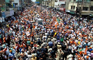 BJP Prime Ministerial candidate Narendra Modi during road show while going to file his nomination for Lok Sabha in Varanasi on Thursday.(UNI)