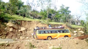 Over loaded bus plying on dilapidated Udhampur-Barmeen road.