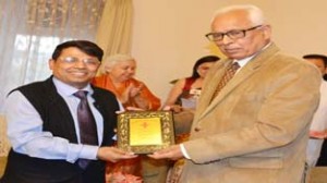 Governor NN Vohra felicitating Shantmanu, Divisional Commissioner Jammu at Raj Bhavan on Friday.