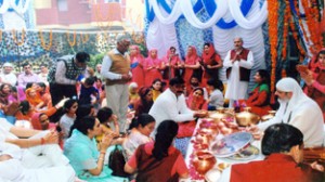 Swami Paul serving prashad to the devotees on the conclusion of yagya on Maha Ramnavmi on Tuesday.