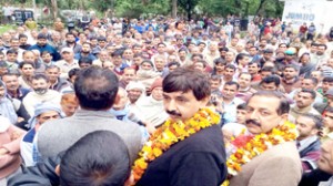 Dr Jitendra Singh and others during an election meeting at village Kambel Denga in Udhampur on Monday.