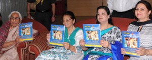 First Lady Usha Vohra and others releasing souvenir of VKWS at Jammu Club on Monday.