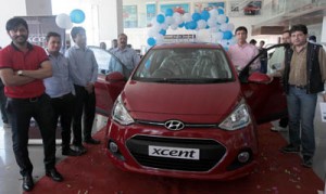 Officials of Crest Hyundai and other dignitaries on the launch of new ‘Hyundai Xcent’ at Jammu on Thursday.  —Excelsior/Rakesh