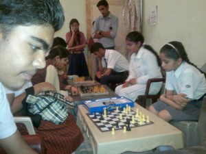 Players making moves during Inter-School Chess Tournament at Udhampur.  