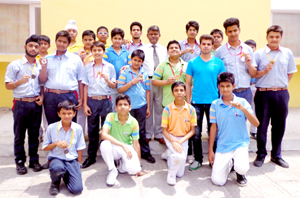 Students of GD Goenka Public School posing for a photograph after winning medals in Kickboxing Championship.