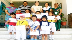 Winners of English Recitation Competition posing alongwith dignitaries.