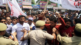 Activists of National Front for Equality being stopped by police at Jammu. -Excelsior/Rakesh