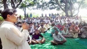 Jugal Kishore Sharma addressing a public meeting at Vijaypur on Friday. -Excelsior/Gautam