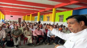 MLC Ravinder Sharma addressing public meeting at Nowshera on Tuesday.