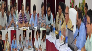 Minister for PWD, Abdul Majid Wani chairing a meeting at Doda on Saturday.