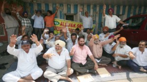 VRS and GHS employees of J&K SRTC staging protest in front of Press Club, Jammu on Saturday. —Excelsior/Rakesh