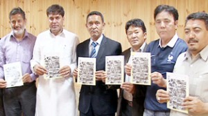 Minister for ULBs, Nawang Rigzin Jora and MoS, PHE Nazir Ahmad Gurezi releasing a book on Friday.