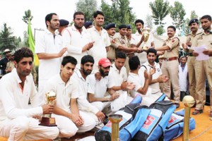 Winners of Police Raising Day Cricket Tournament posing for a group photograph at Pulwama.