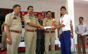 IGP PR Manhas alongwith others awarding winner of symposium organised by IRP 5th Battalion at Doda district on Sunday.