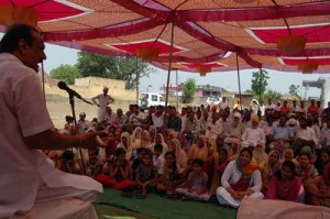 MLA S S Slathia addressing a public meeting at Ramgarh on Friday.