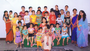 Children posing for a group photograph during the summer camp for charity on Monday.