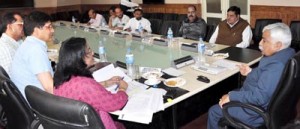 Minister for Planning Ajay Sadhotra chairing a meeting at Srinagar on Wednesday.