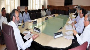 Chief Secretary Mohd Iqbal Khandey chairing a meeting at Srinagar on Wednesday.