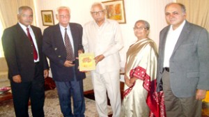 'The Languages of J&K' being presented to the Governor N N Vohra at Raj Bhavan on Monday.