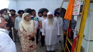 MLC Dr Shehnaz Ganai dedicating water cooler to devotees at Nangali Sahib in Poonch on Sunday.