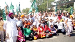 PDP activists taking out protest rally against power and water shortage in Jammu on Tuesday. -Excelsior/ Rakesh