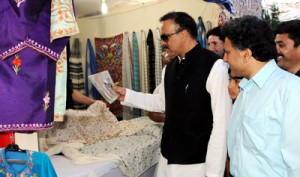MoS Industries and Commerce, Sajjad Ahmed Kichloo inspecting a stall in exhibition on Wednesday.