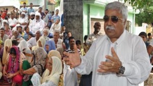 Minister for Planning Ajay Sadhotra addressing public gathering at Jammu on Friday.
