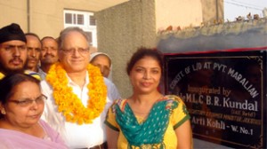 Cong MLC, B R Kundal inaugurating lane at Muralian in R S Pura on Friday.