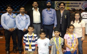 Meritorious students of Jodhamal School posing alongwith Principal and other officials during felicitation function.