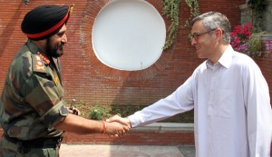 Chief Minister Omar Abdullah and Army chief Gen Bikram Singh shake hands before their meeting in Srinagar on Saturday.