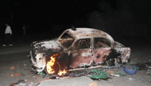 A vehicle burnt down by the mob at Bari Brahmana on Sunday.—Excelsior/Rakesh