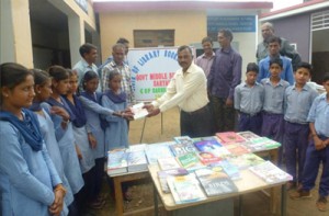 Books being distributed among school children by Rashtriya Rifles on Monday.