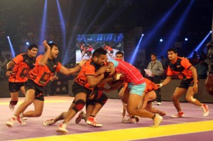 Moments of action during the opening match of Pro-Kabaddi league between U-Mumbai (black and orange) and Jaipur Pink Panthers in Mumbai on Saturday night. UNI