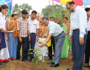 Chairman of BSF School, Paloura, S S Tomar, IG BSF Jammu Frontier planting sapling during his farewell ceremony on Wednesday