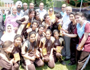 Mallinson Girls School Football team posing for a group photograph alongwith the chief guest and other dignitaries in Srinagar on Friday. -Excelsior/Amin War