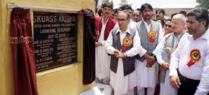 Minister for Agriculture Ghulam Hassan Mir and Minister for Tourism Ghulam Ahmad Mir laying foundation stone of KVK at Nowpora on Saturday.