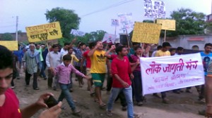 The residents of Badyal Brahmana, R S Pura holding protest rally on Sunday.