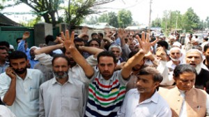 Supporters of sitting MLA holding protest demonstration on Monday. -Excelsior/Younis Khaliq