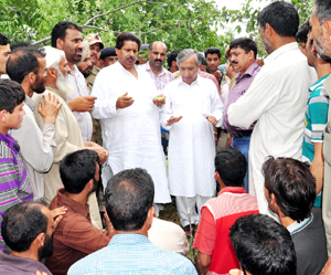 Minister for Horticulture Raman Bhalla interacting with residents during his tour of South Kashmir on Wednesday.