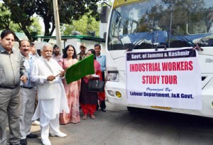 Minister for Planning Ajay Sadhotra flagging off industrial workers on study tour at Jammu on Sunday.