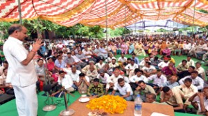 Deputy Chief Minister Tara Chand addressing public gathering at Khour on Monday.