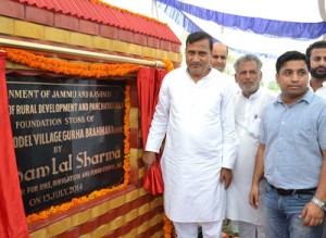 Minister for PHE, Sham Lal Sharma laying foundation stone of model village Gurha Brahmana in Akhnoor on Sunday. 