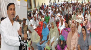 Minister for PHE, Sham Lal Sharma addressing public meeting at Akhnoor on Tuesday.