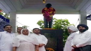 Madan Lal Sharma, former Member Parliament and other dignitaries paying homage to Shaheed Gurdeep Singh Soni at his native village Palauta in Ramgarh.
