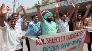 Short-listed jail warden candidates raising slogans during protest at Jammu on Friday. -Excelsior/Rakesh